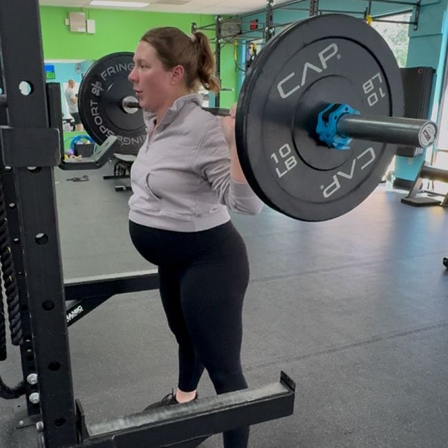 Pregnant mom lifting weights